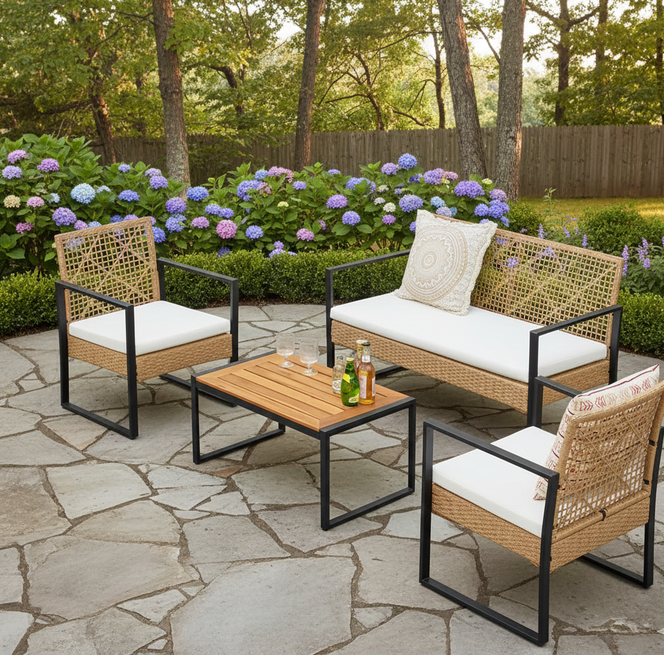 4-piece outdoor wicker rattan patio set with a loveseat, two chairs, and a coffee table on a patio.