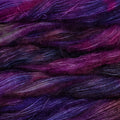 Soft skeins of Malabrigo Mohair yarn in shades of purple, magenta, and navy.
