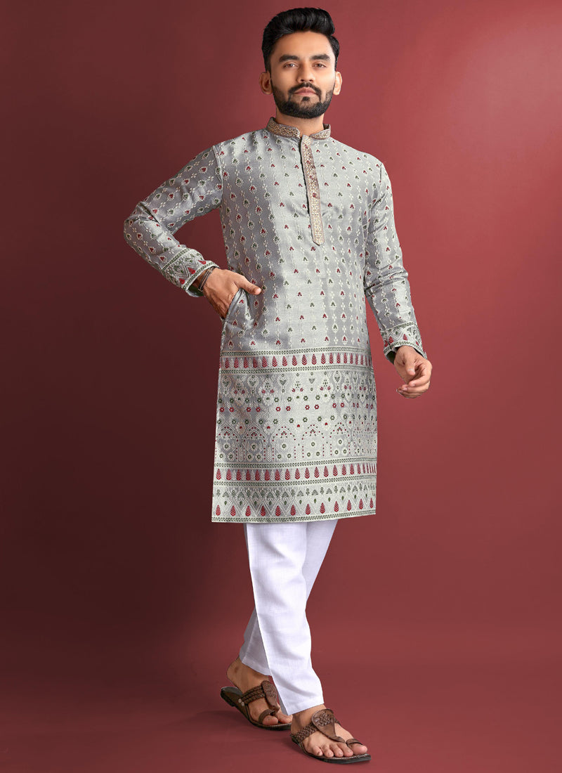 Men wearing a grey Jacquard silk kurta featuring detailed Amboj embroidery work