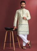 Men wearing an Off White Jacquard Silk Kurta with intricate Amboj work and collar-neck
