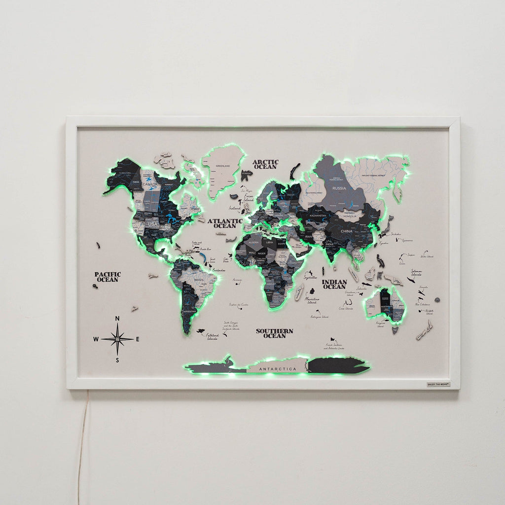 Minimalist wooden world map on a cork board with integrated LED lights