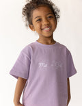 A child wearing a comfortable oversized Me Plus God graphic tee with a relaxed fit.