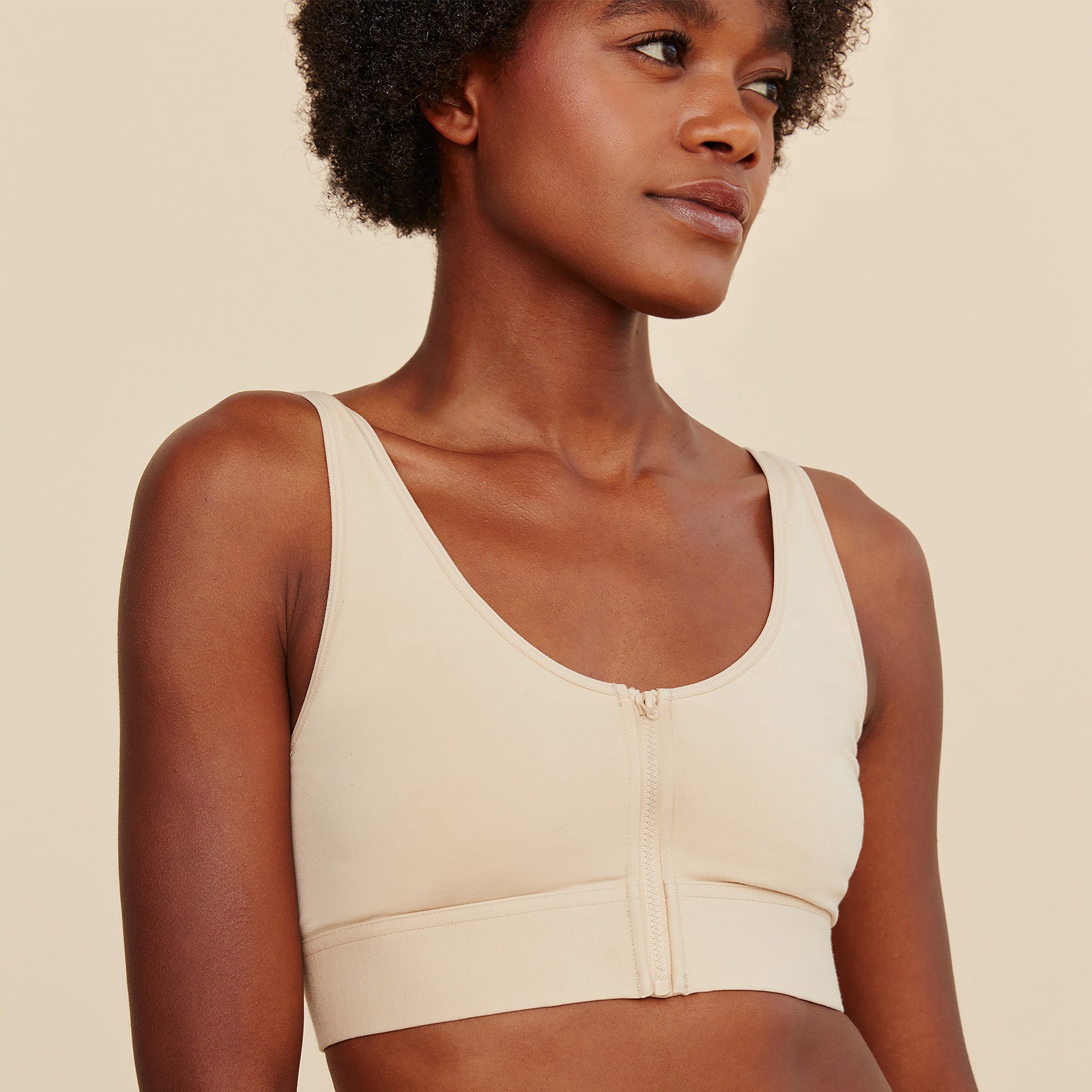 Model wearing a comfortable Beige Wilderness Front-Closure Bralette made from soft cotton modal fabric.