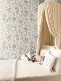 Mercedes floral pattern wallpaper in peach and sage-green for bohemian nursery decor