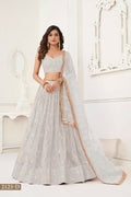 Off White Butterfly Net Lehenga Choli with intricate thread and mirror embroidery for wedding wear.