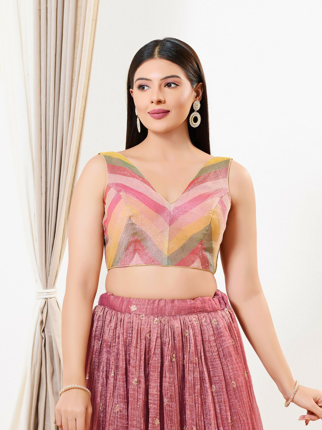 Rust colored tissue sleeveless blouse with a V-neckline for evening events