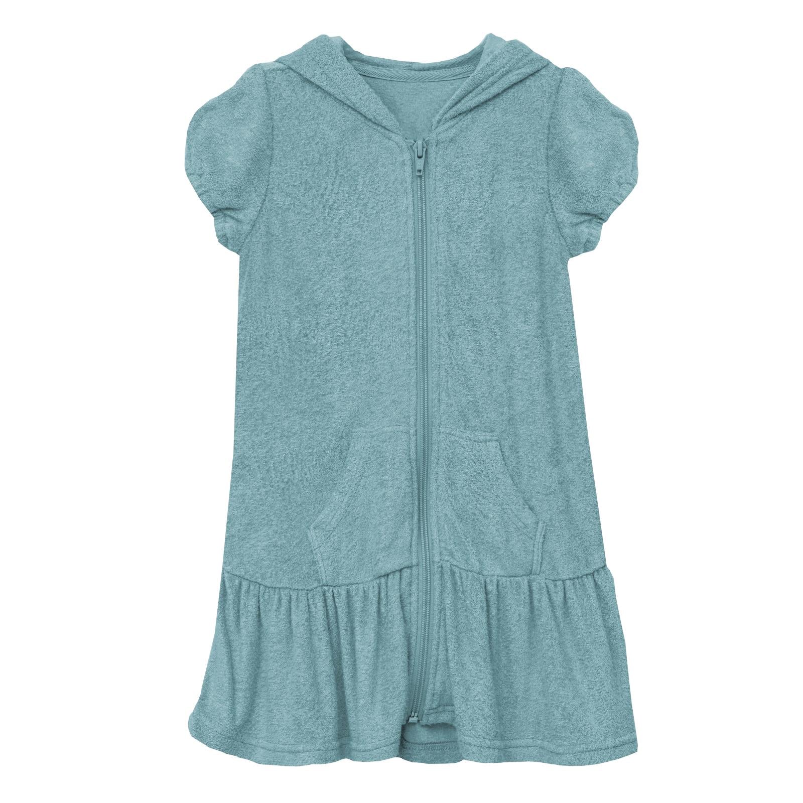 Child wearing a Glacier teal plush terry swim cover-up with ruffled hem and hood