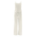 Women's cami and lounge pants pajama set in natural color, showing a spaghetti strap top and matching wide-leg drawstring pants.