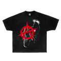 A man wearing a white graphic t-shirt with a red anarchy symbol and black print, styled with cyberpunk eyewear.