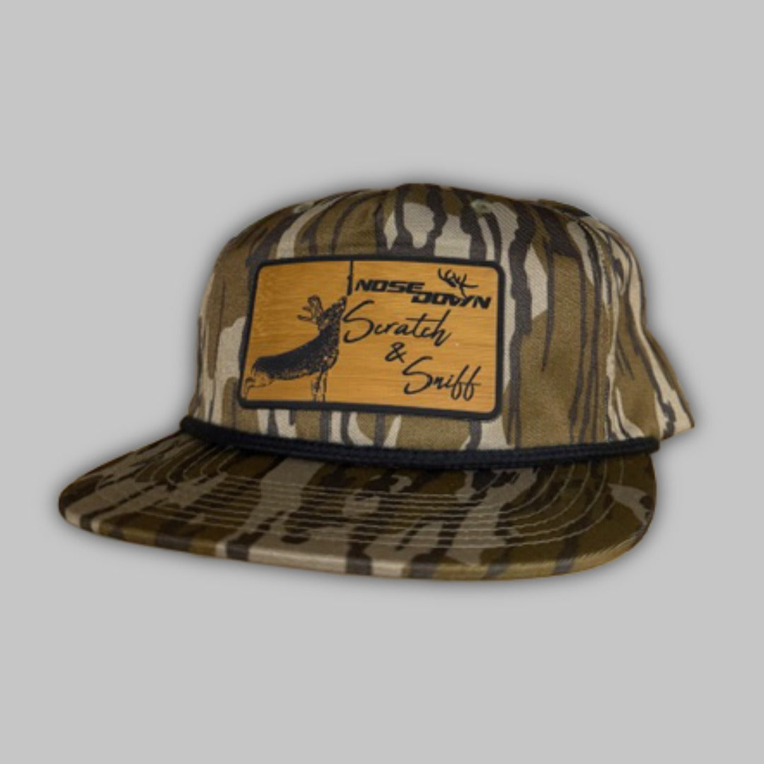 Scratch and Sniff rope hat in camo with brown, tan, and black accents