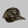 Vintage black trucker hat with a premium woven logo patch.