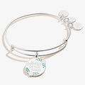 Mother of the Bride charm bangle with soft white enamel charm on a gold-tone wire.