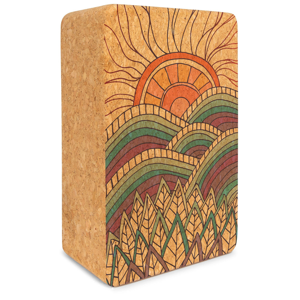 Solid brown cork yoga block with rounded edges and Mountain Magic branding