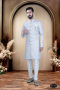 Men's grey and white cotton silk kurta featuring intricate thread and sequence embroidery with matching white pyjama.