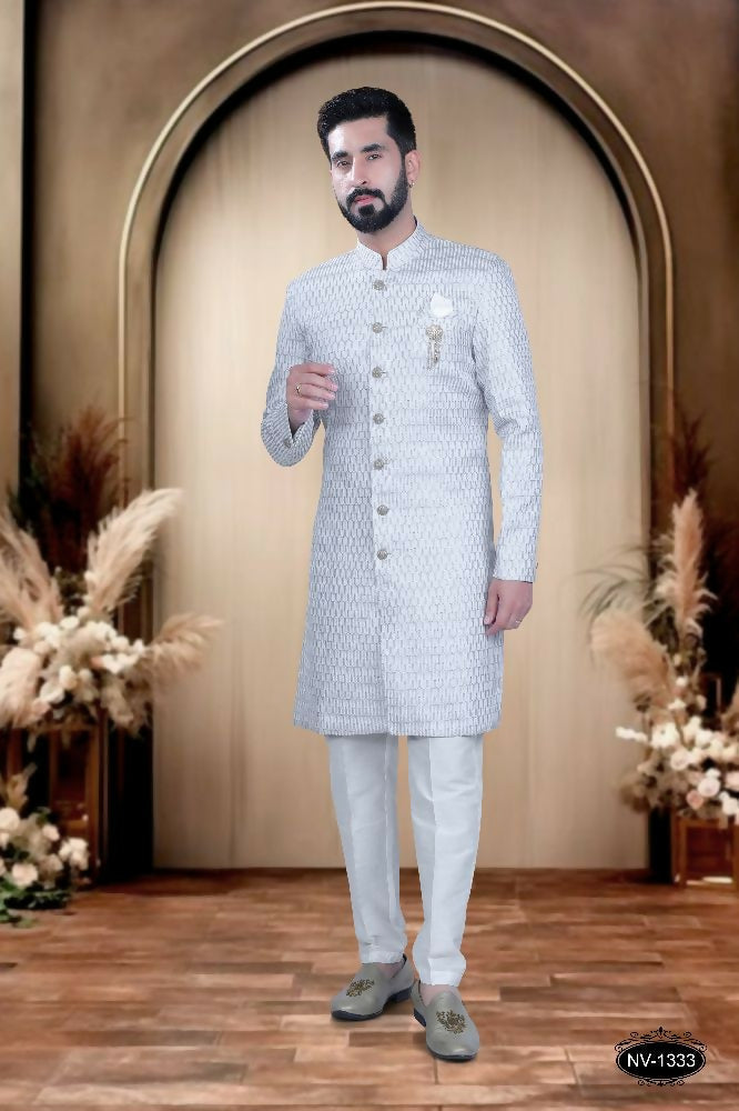 Men's grey and white cotton silk kurta featuring intricate thread and sequence embroidery with matching white pyjama.