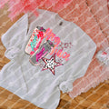 White sweatshirt with colorful graphics and text on a checkered floor.