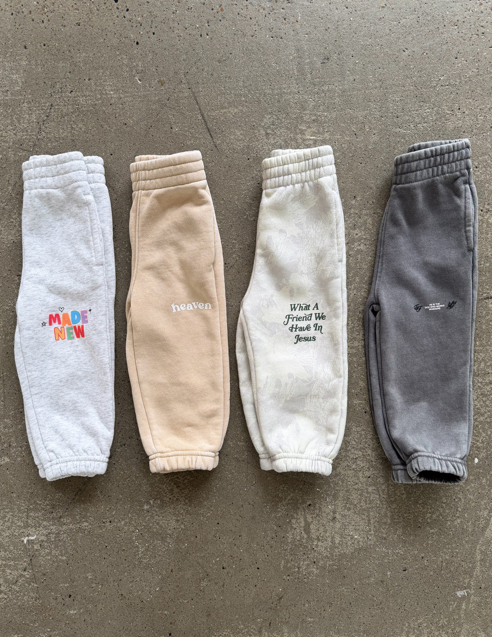 A pair of comfortable, oversized kids sweatpants in a mystery surprise style