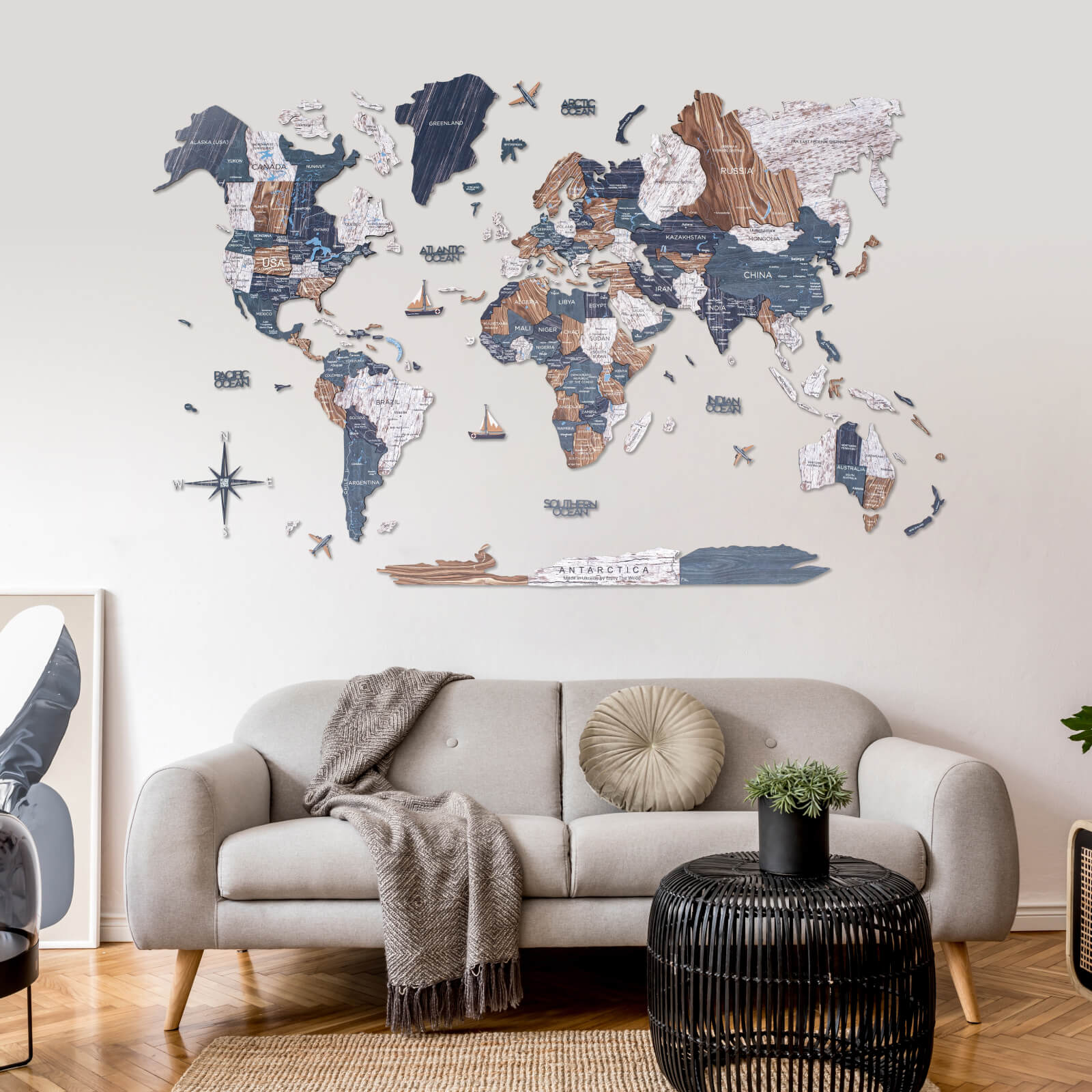 3D Wooden World Map Mystery featuring navy, white, and natural wood tones on a wall