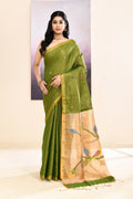 Close-up of an olive tissue Jamdani saree showing intricate embellishments and fabric texture