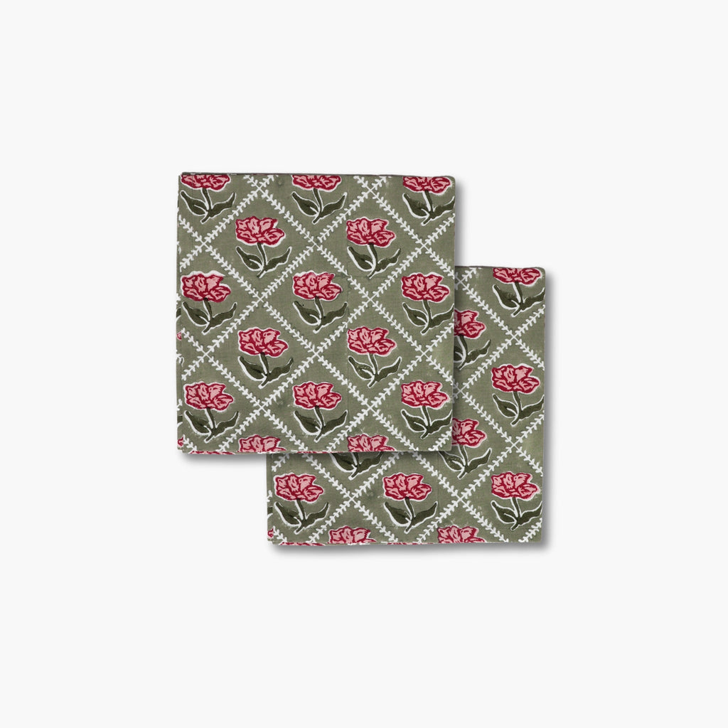 Set of two Noor cotton table napkins featuring a hand-block printed rose motif in olive green and pink.