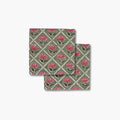 Set of two Noor cotton table napkins featuring a hand-block printed rose motif in olive green and pink.