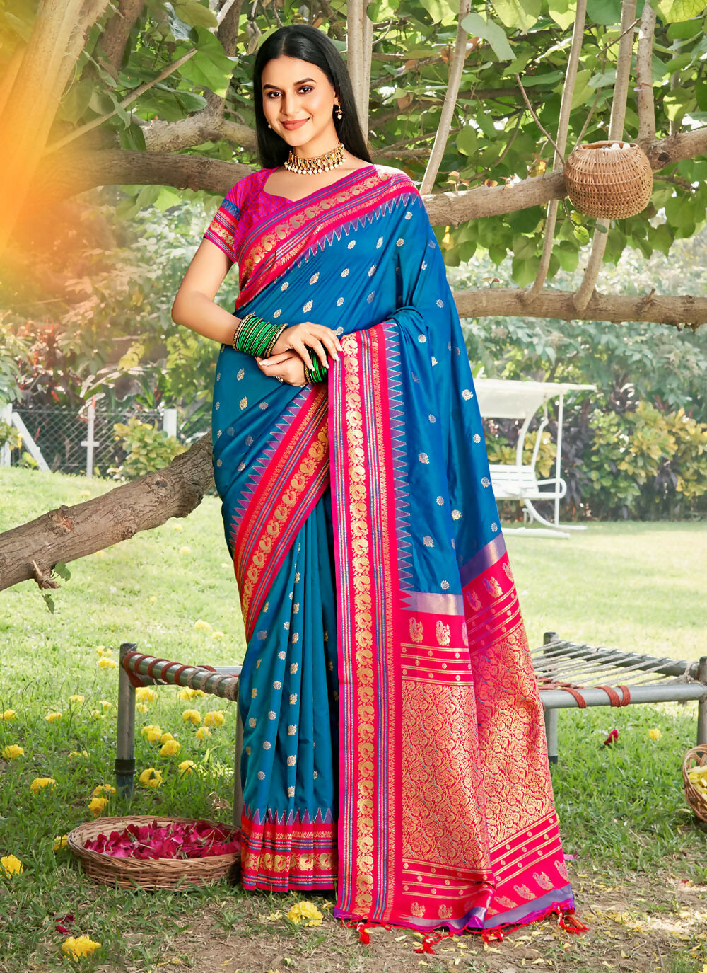 Beautiful blue soft silk saree with a matching blouse piece, draped elegantly.