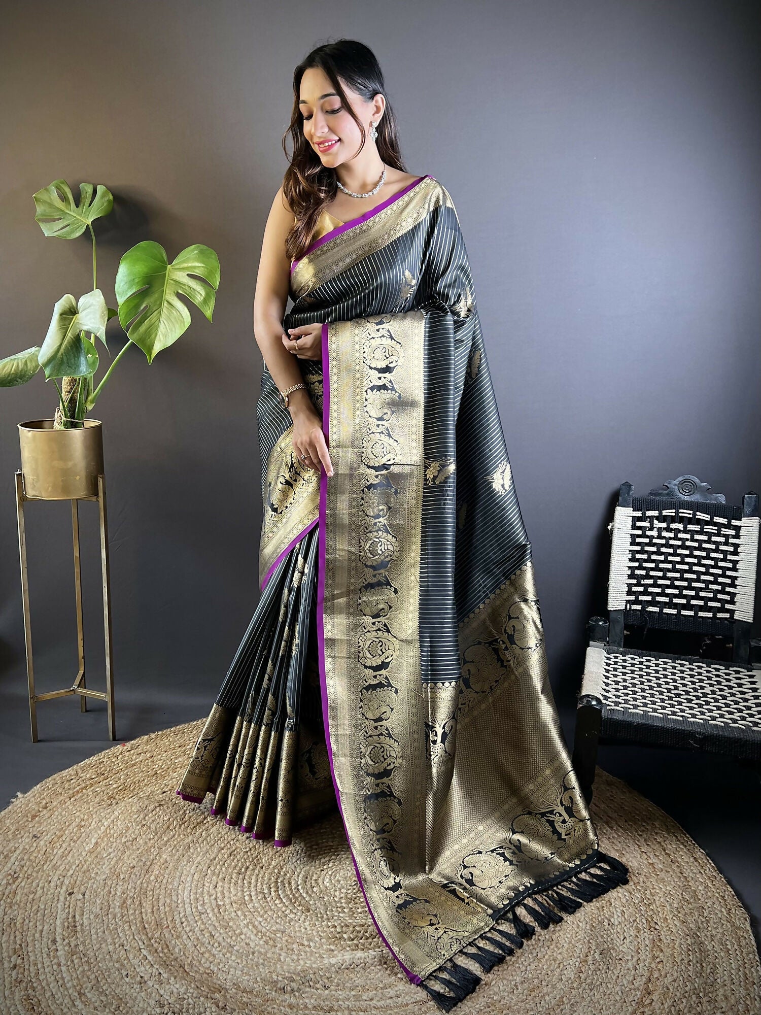 Black soft silk Leheriya saree with floral motifs and solid black unstitched blouse