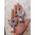 Multicolor alloy drop and mirror hanging jhumka Chandbali earrings in oxidized silver.
