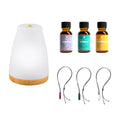 Zen Luxury Wellness Bundle containing an ultrasonic aroma diffuser, three bottles of essential oils, and three gemstone pendant necklaces