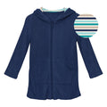 Terry zip-front robe in Flag Blue with horizon-stripe hood worn after swimming.