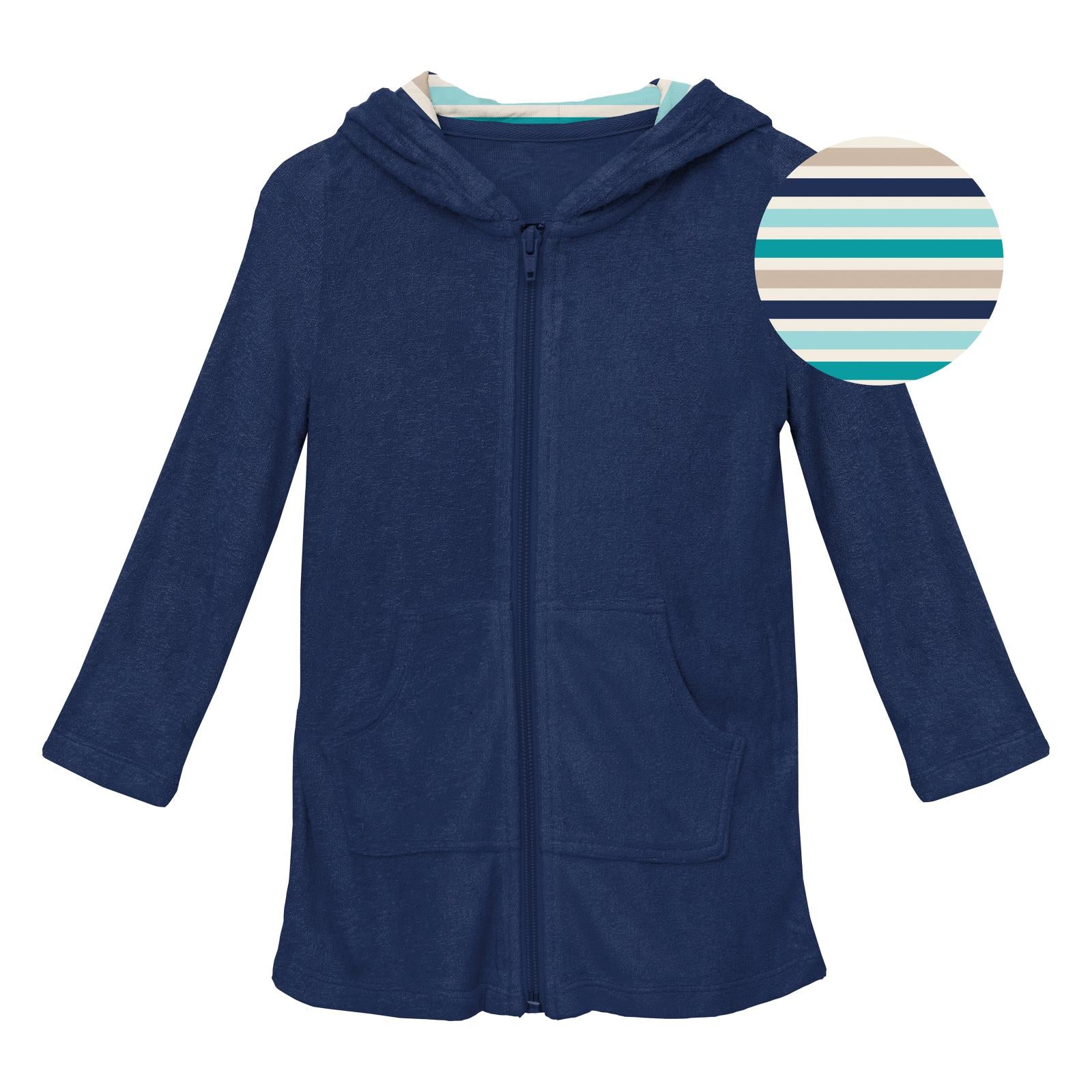 Terry zip-front robe in Flag Blue with horizon-stripe hood worn after swimming.