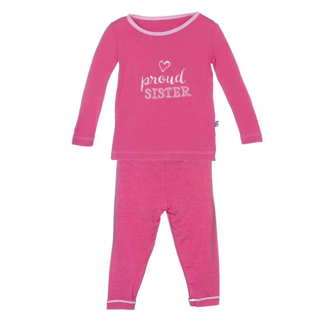 A toddler long sleeve two-piece pajama set in Winter Rose pink with a Proud Sister graphic on the front.
