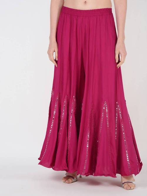 Magenta flared viscose rayon palazzo with mirror lace trim detailing.