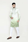 Deep green satin silk kurta paired with matching straight trousers.