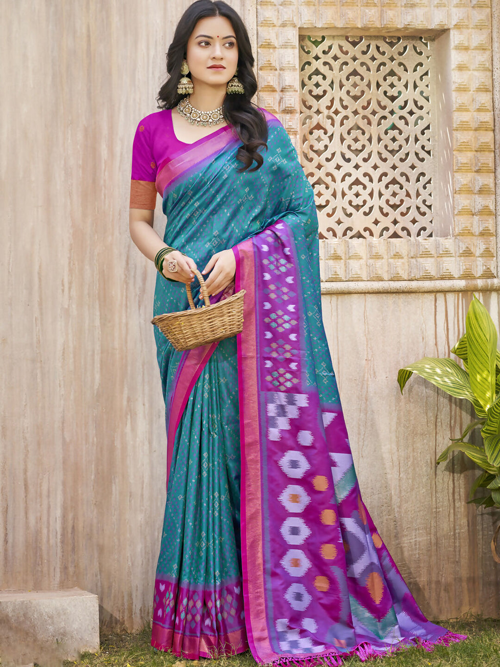 Traditional Pochampalli silk saree in sea green with a teal blouse