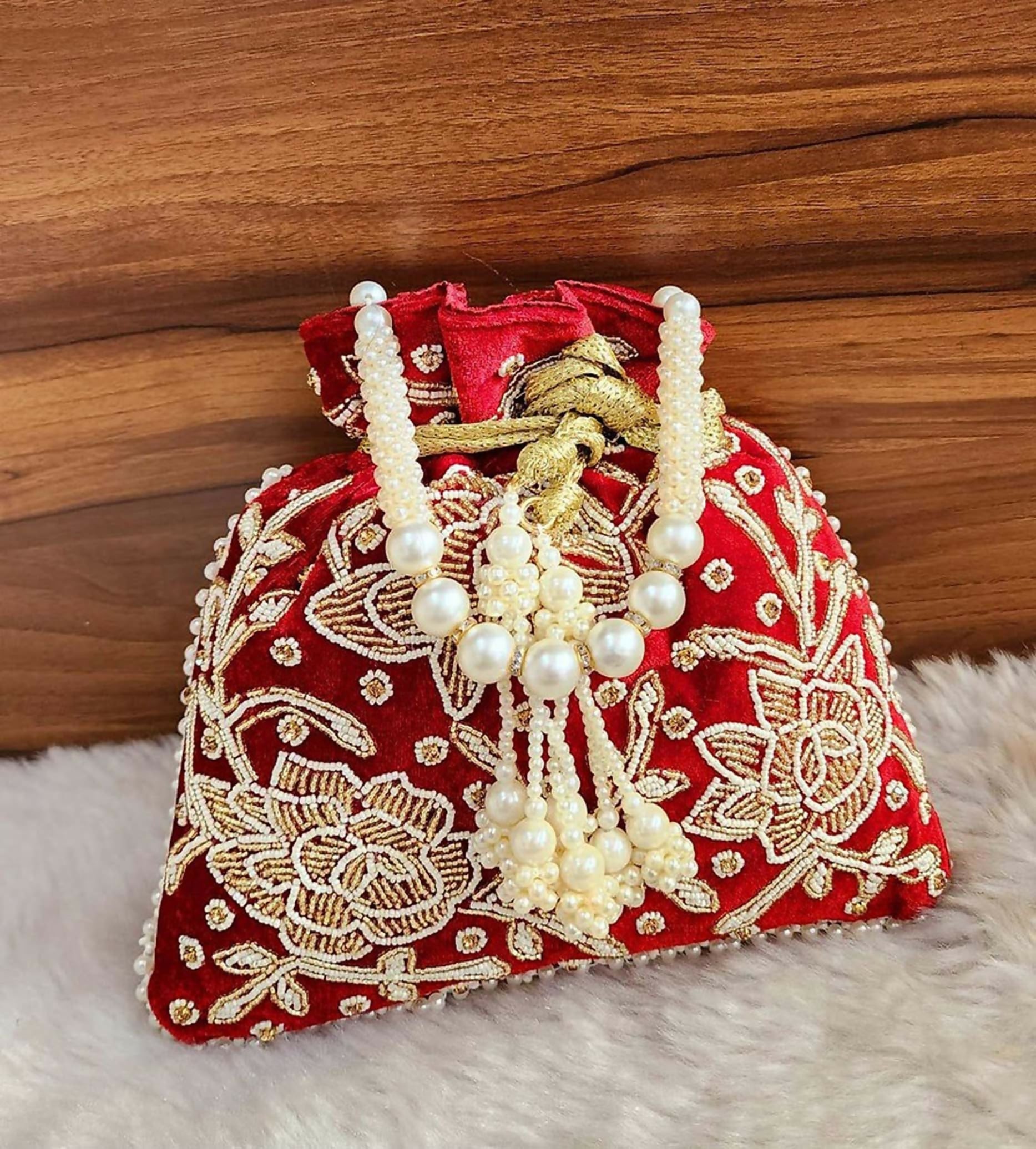 A stylish red synthetic Joban Fashion potli bag for ethnic wear, 9x9 inches
