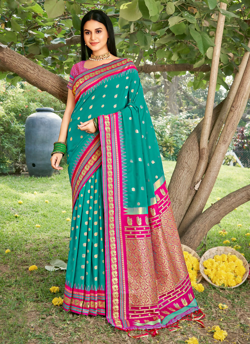 Elegant Sea Green Soft Silk Saree featuring a smooth finish and matching blouse piece.