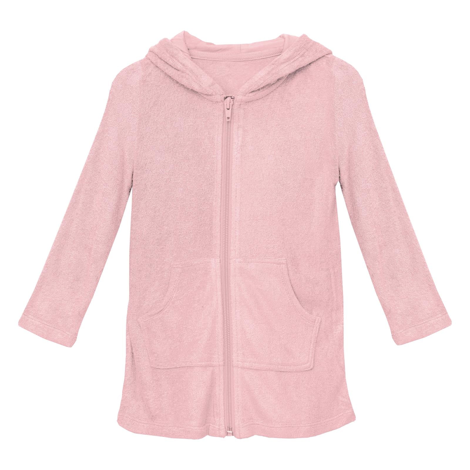 Terry Zip-Front After Swim Robe in Lotus pink color, shown in a cozy poolside setting.