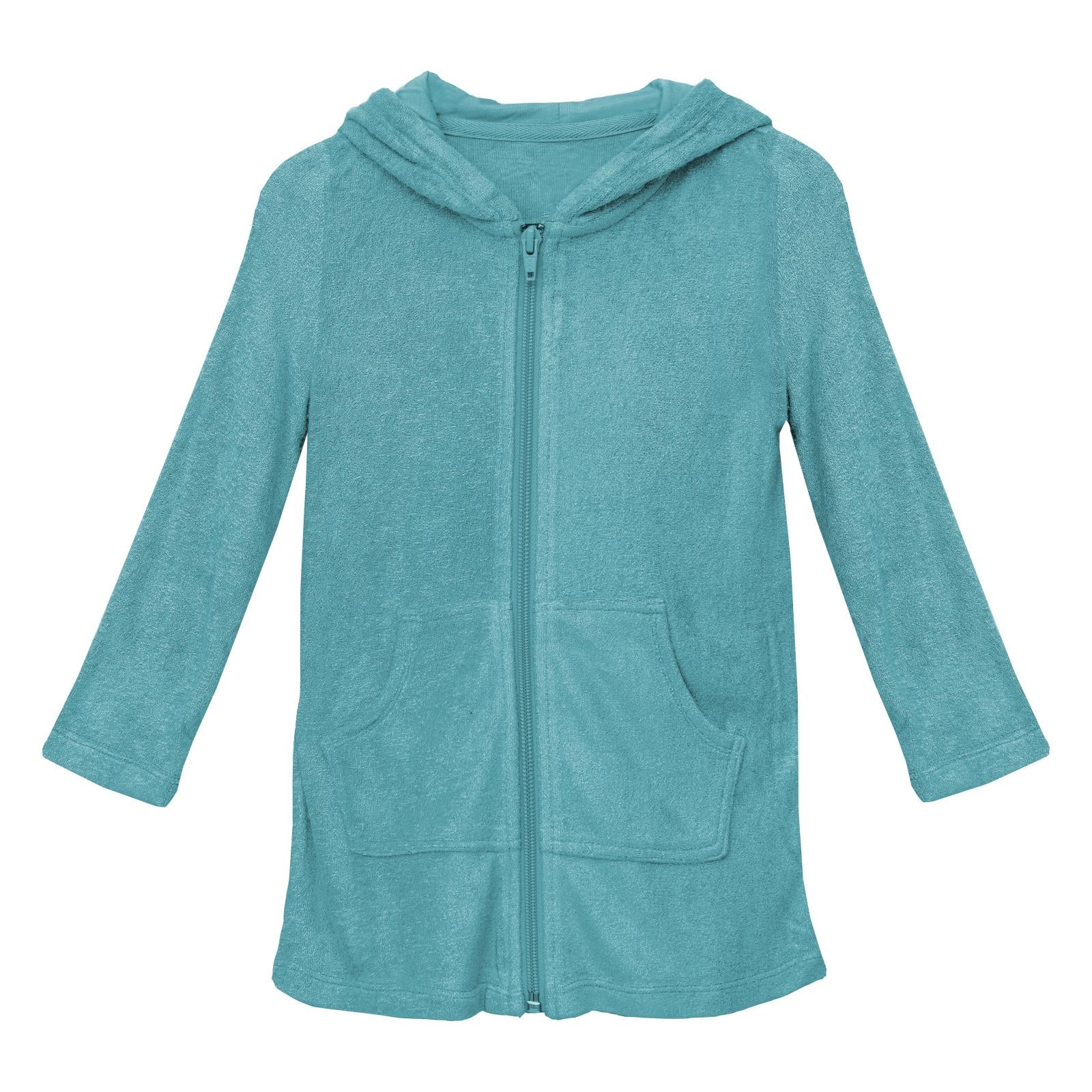 Child wearing a deep sea-teal Terry Zip-Front After Swim Robe in Glacier.