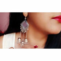 Triple jhumka hanging earrings with kite shape and mirror work in silver tone.