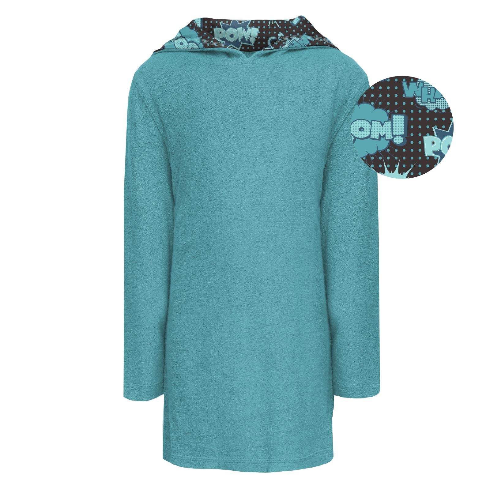 Child wearing a Summer Sky teal terry pull-over swim robe with a comic-book print lined hood.