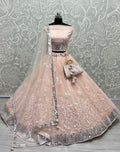 Peach bridal net lehenga choli with sequin embroidery and cancan flare