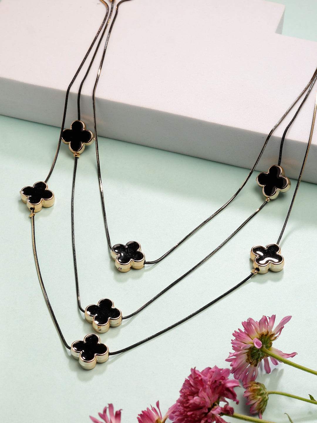 An elegant, multi-layered black fashion necklace perfect for layering with any outfit.