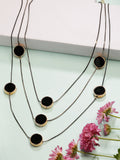 Modern black layered necklace with circular pendants styled for a chic look