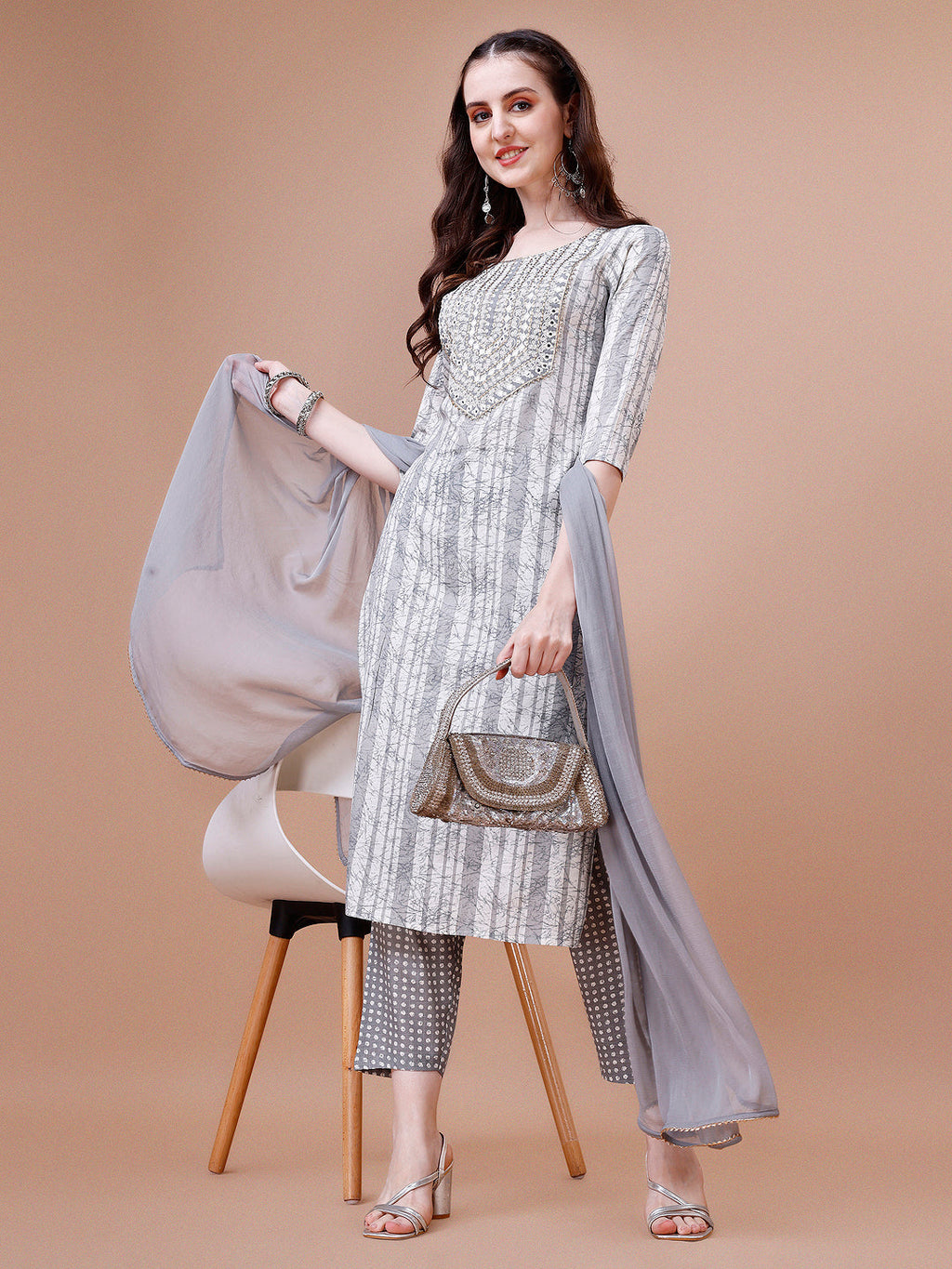 Multicolor kurta set featuring mirror embroidery and striped print with matching pant and dupatta.