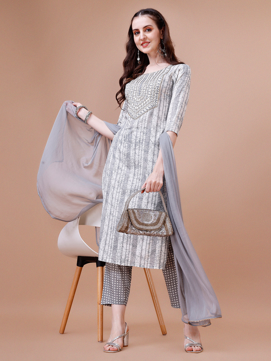 Multicolor kurta set featuring mirror embroidery and striped print with matching pant and dupatta.