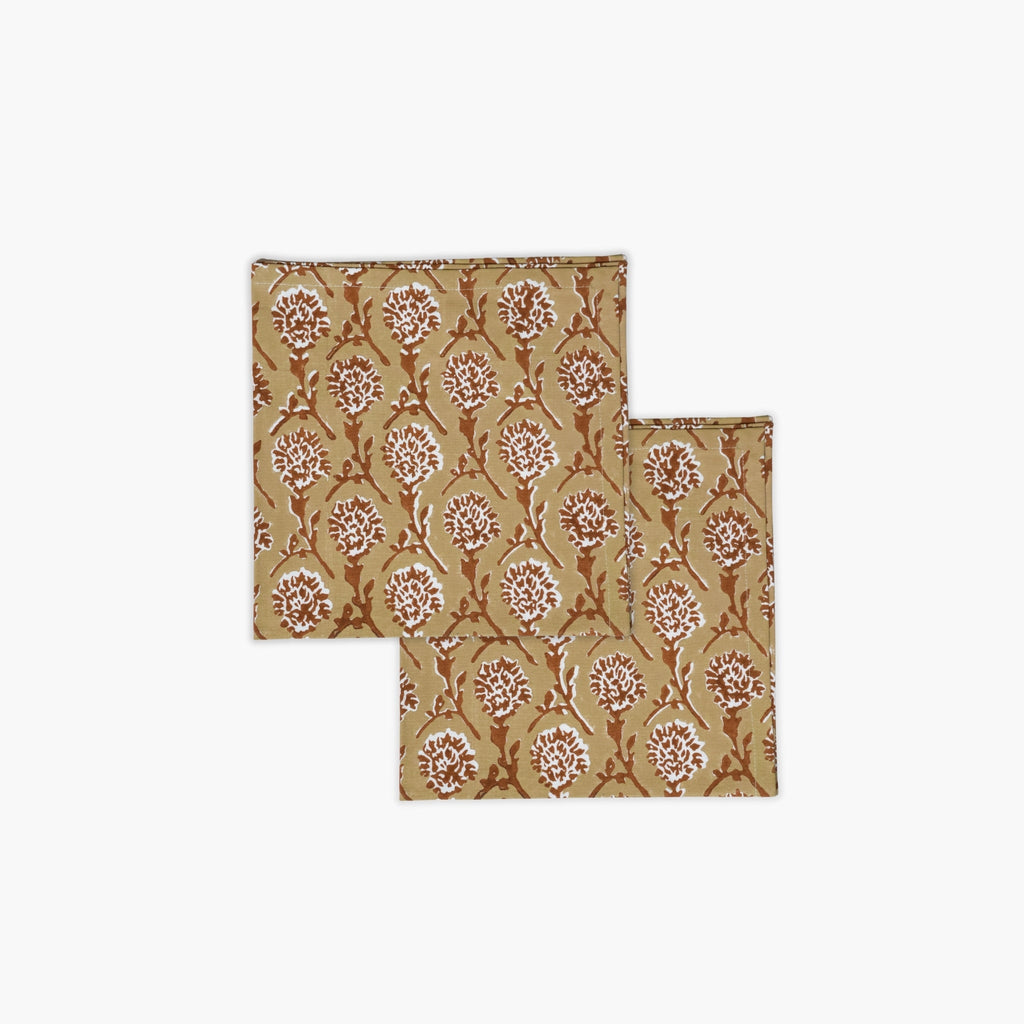 Set of two Nikhar cotton table napkins featuring a chai brown hand-block chrysanthemum floral print.