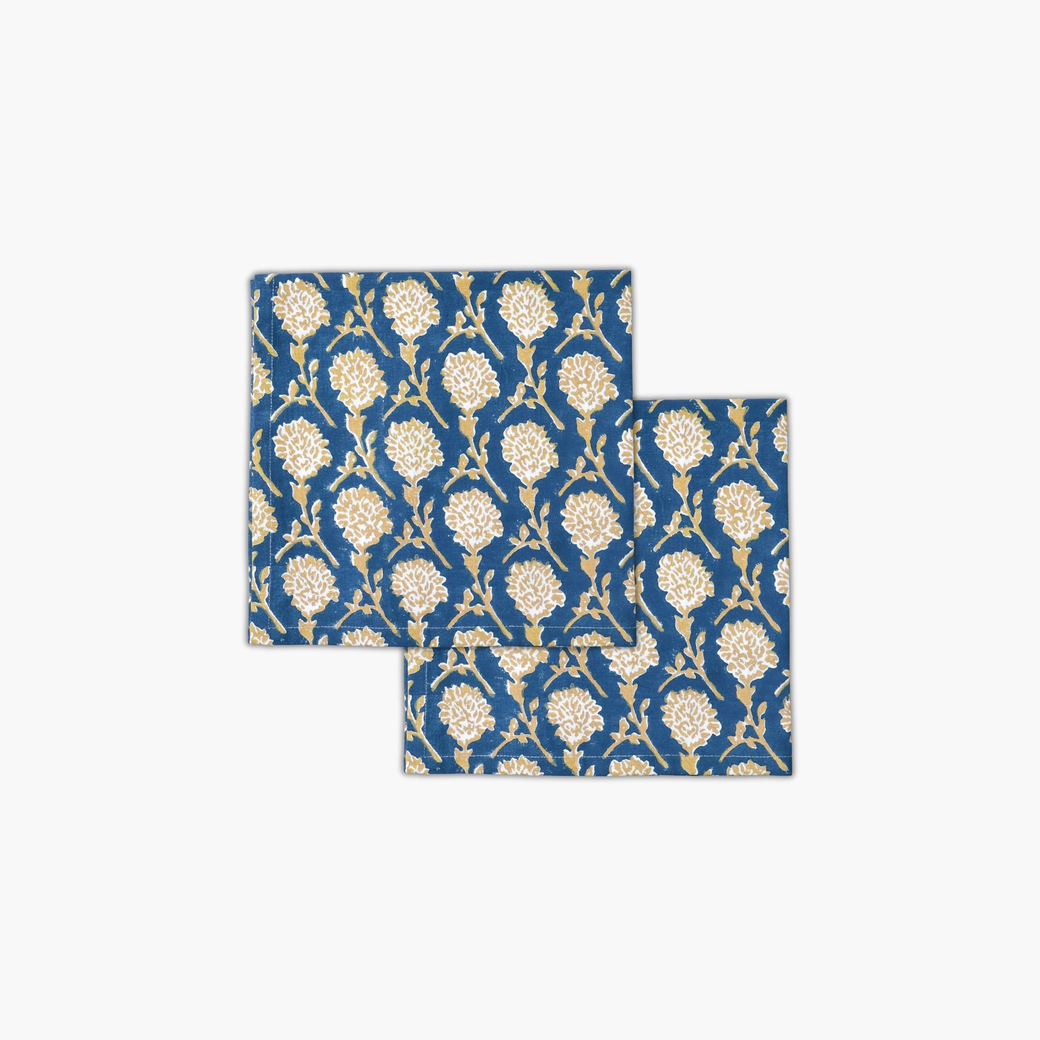Set of two Nikhar ink blue cotton table napkins with sand brown Mughal floral hand-block prints.