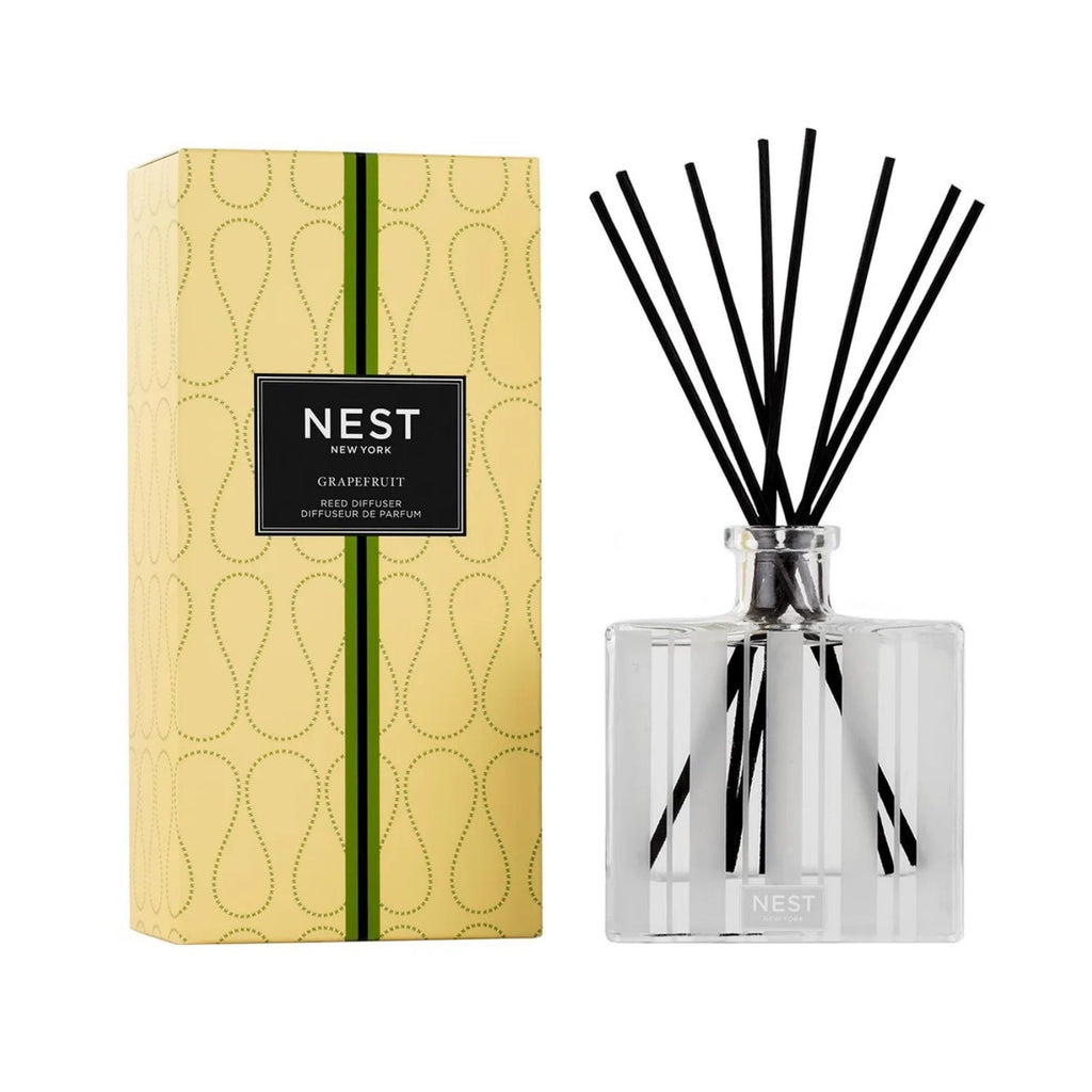 Modern minimalist 5.9 oz grapefruit reed diffuser in a clear and black striped glass bottle