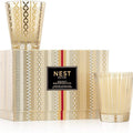 NEST New York Holiday and Birchwood Pine Classic Candle set displayed in elegant glass vessels.